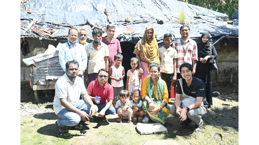 事業地の厳しい環境にある家族と一緒に。